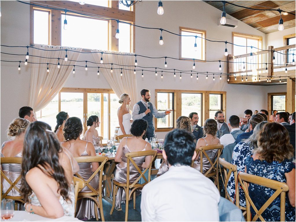 Wedding couple giving a speech to their wedding guests