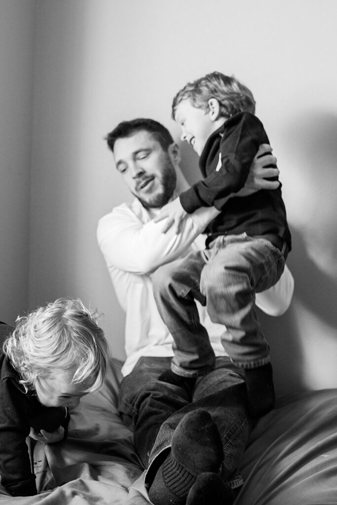Dad wrestling with his sons