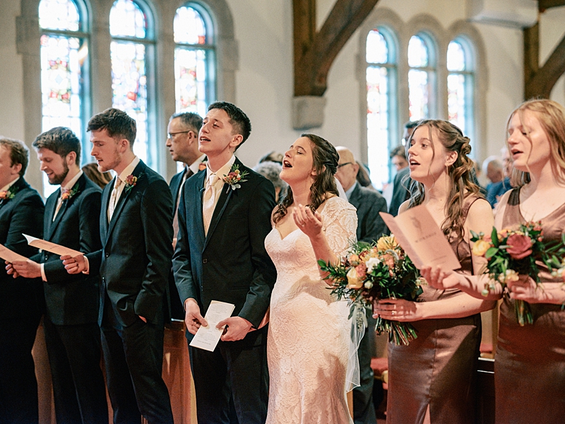 Bride and Groom worshipping at Country Cathedral Wedding