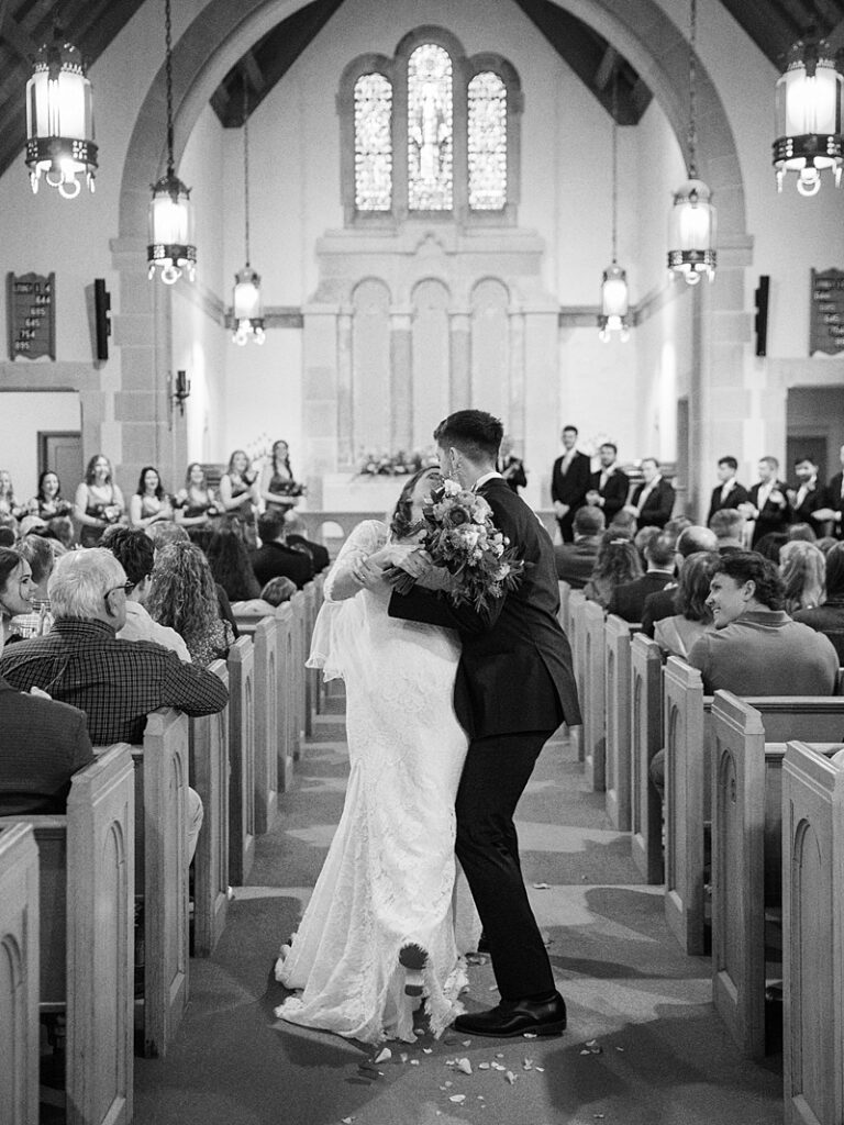 Bride and Groom kiss after ceremony at Country Cathedral Wedding
