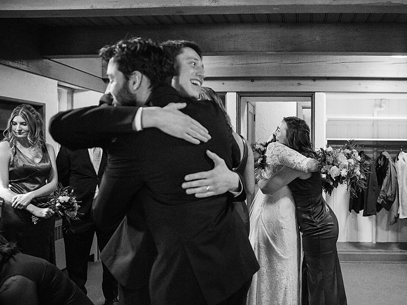 Bride and Groom hugging friends at Country Cathedral Wedding