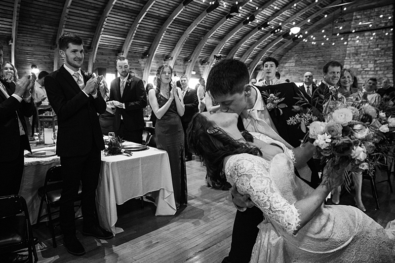 Bride and Groom kissing during wedding reception entrance