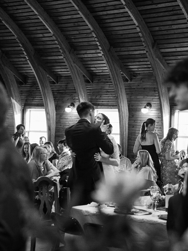 Bride and Groom kissing at wedding reception
