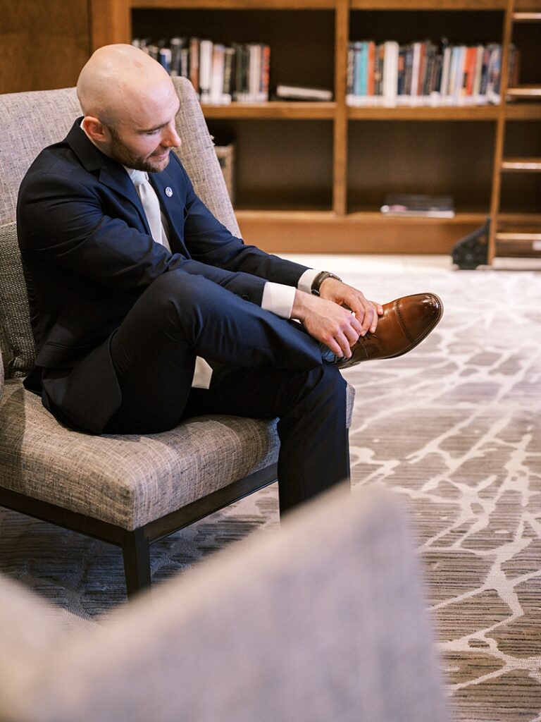 Groom getting read at Hyatt Regency Coralville